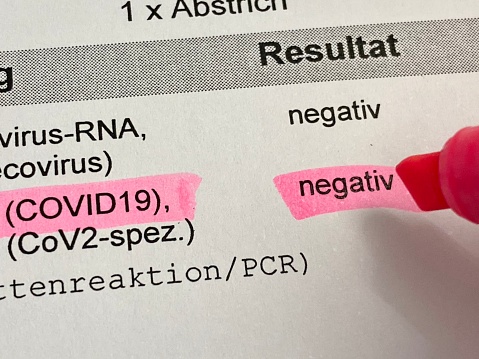 Negative Covid PCR swab Test result highlighted on laboratory sheet