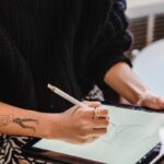 Uncover the hidden connection between graphic design and tattoo artistry.